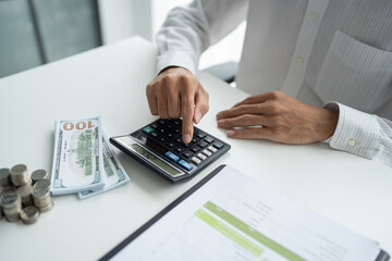 Businessman checking bills taxes bank account balance and calculating annual financial statements of company. Accounting Audit Concept
