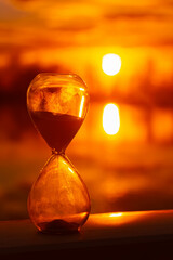 Summer sunset or sundowner view with an hourglass near Plattling, Isar, Deggendorf, Bavaria, Germany