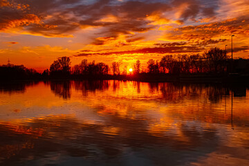 Spring sunset or sundowner view with reflections near Plattling, Isar, Deggendorf, Bavaria, Germany