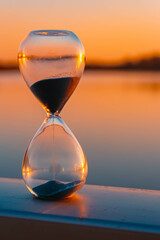 Summer sunset or sundowner view with an hourglass near Plattling, Isar, Deggendorf, Bavaria, Germany