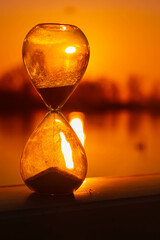 Summer sunset or sundowner view with an hourglass near Plattling, Isar, Deggendorf, Bavaria, Germany