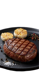Grilled Steak With Garlic And Peppercorns On Black Plate Isolated Background