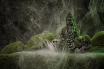 Homemade buddha statue with fake moss and grass surrounded with swirling mist and fog Handmade and...
