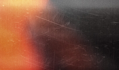 grainy colorful warm orange light leaks on black background with dust texture. abstract damaged scratched retro film analog effect for using over photos as overlay or screen filter