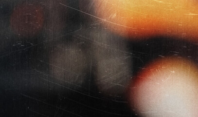 grainy colorful warm orange light leaks on black background with dust texture. abstract damaged scratched retro film analog effect for using over photos as overlay or screen filter