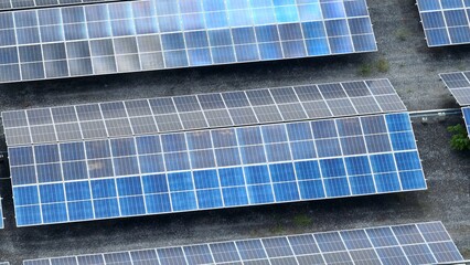 This aerial perspective emphasizes the wide-reaching impact of solar energy installations, showing the technological shift toward cleaner energy sources and large-scale renewable power generation.
