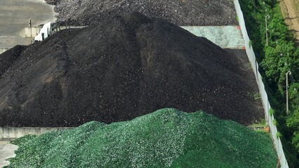 The aerial view reveals the glass recycling process at work, symbolizing the efficiency and...