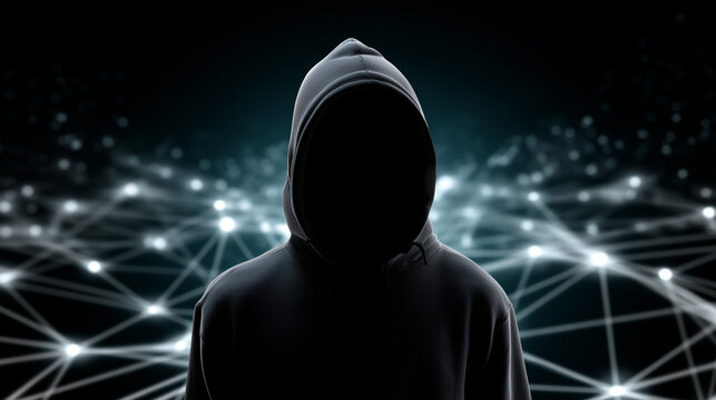 Silhouette of a person in a hoodie standing in front of a glowing digital network background, symbolizing hacking and cybersecurity threats.
