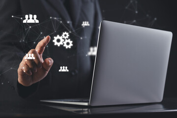 Executive uses advanced digital tools on virtual screen to illustrate goal focused leadership, operational efficiency and the role of smart systems in shaping organizational success