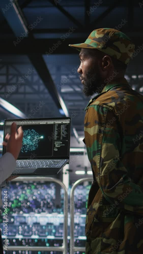 Poster vertical video military server room it professionals using ai llm tech on laptop to review network p