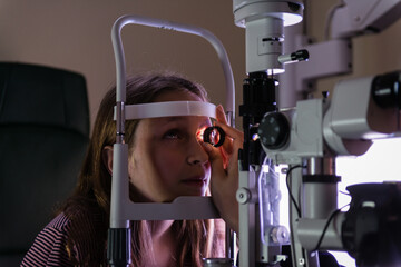 teen girl at the optometrist during an eye exam