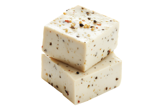 Cubes of seasoned tofu with visible herbs and spices, arranged in stack isolated on white transparent background, concept of healthy vegetarian protein option