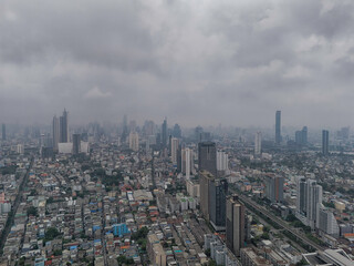 Aerial view of Bangkok Thonburi district urban landscape on a cloudy day during the rainy season. 