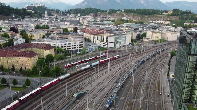 Salzburg Austria skyline of Salzburg HBF train station and town in 4k during sunset