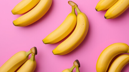 Fresh bananas arranged pink background, showcasing their vibrant yellow color and smooth texture, perfect for healthy eating