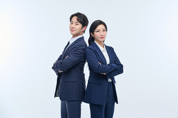 Confident Asian Businessman and Businesswoman Standing Back to Back in Formal Suits, Gesturing Ideas and Vision on White Background
