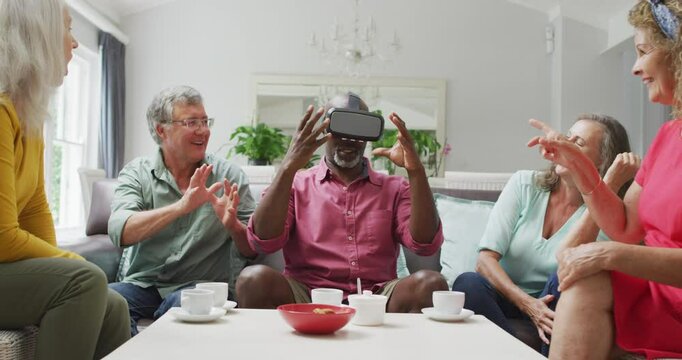 Animation of diverse female and male senior friends using vr headset and having fun