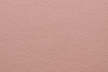 Soft minimal felt texture background in light dusty rose, smooth wool surface, quiet tactile feel, aesthetic clean mood