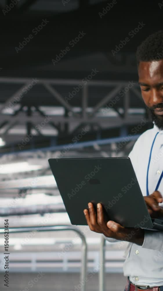 Poster vertical video system administrators in data center using laptop to monitor neural network llm visua