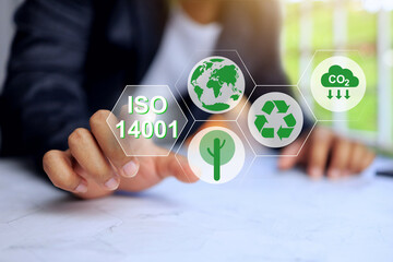 ISO 14001 concept with businessman working environment management to reducing environmental impact and improving efficiency saving cost enhancing company reputation and gaining a competitive advantage
