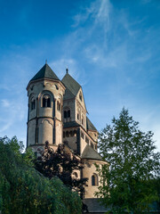 Medieval church towers of the abbey Maria Laach, Rineland-Palatinate, Germany above green garden