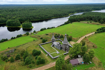 wooden church on the lake shore, drone photo, Kenozersky Park top view