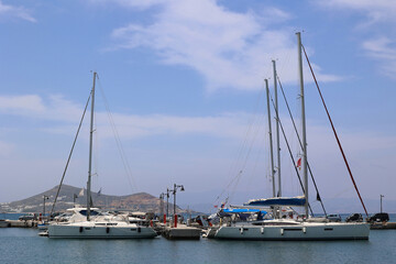 Obraz premium Sailing boats in the port of the Cyclades Island of Naxos-Greece