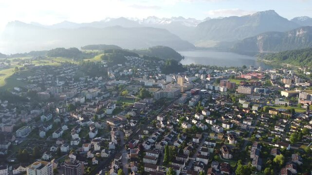 Aerial drone view of Lucerne cityscape, Lake Lucerne, and Swiss Alps mountains landscape, Switzerland