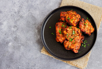 Indian Spiced Tandoori Chicken Thighs  Garnished with Fresh Cilantro