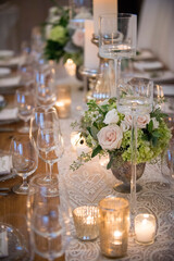 Romantic Candlelit Table with Roses and Glassware