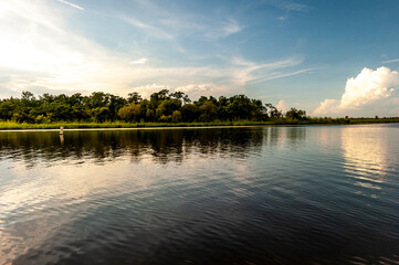 Mobile Bay on dusk with dramatic clouds.