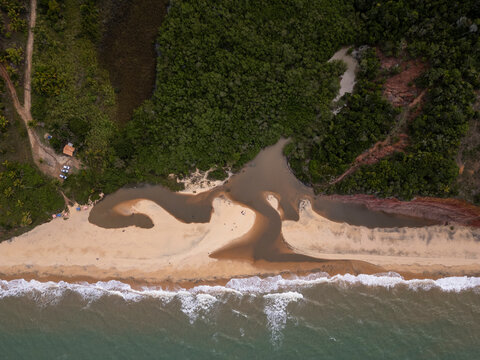 Beautiful aerial view to wild Japara Mirim beach with red cliffs