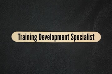 Wood with the words training development specialist