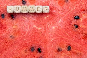Summer text on vibrant watermelon background with juicy texture and seeds. Copy space