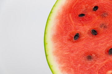 Close-up of freshly sliced watermelon showing juicy red flesh and black seeds