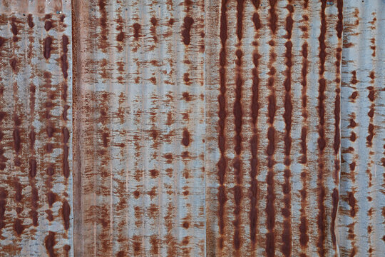 Rusty old corrugated tin metal for surface texture background