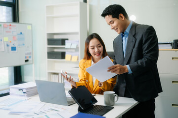 Kind leader executive manager share and discuss business solutions plan ideas on tablet with Asian...