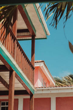Fototapeta Colorful tropical building with wooden balcony under Belize sky