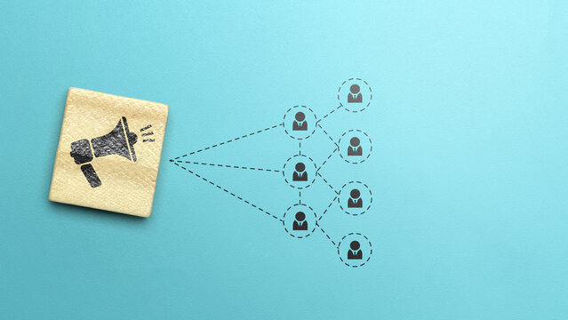 Megaphone icon on wooden cube icon with flowchart of people on colored background. Concept of lead generation
