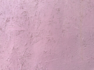 Fototapeta premium Pink paint cracks on wood surface. texture of painted pressed wood