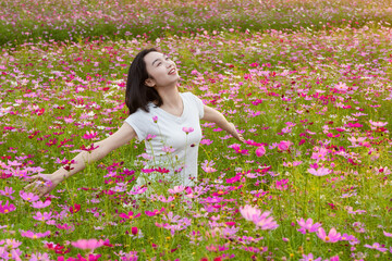 Chinese woman in a sea of flowers