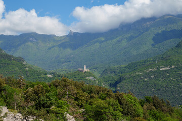 Castel Drena (12th century), a hilltop castle ruin in the Drena valley in the lush countryside of the Sarca Valley, Trentino, Italy.