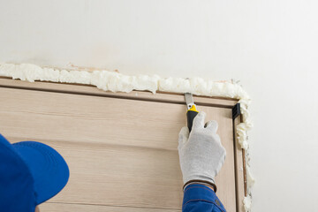 Removing unnecessary dried mounting foam from the door slot