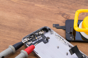 Disassembled phone display and gadget repair tools, close-up