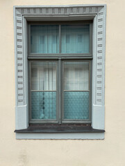 Vintage, grunge window isolated on beige wall background, german old window.