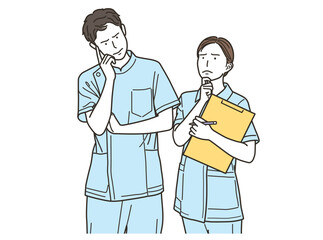 心配そうな顔で悩んでいる医療従事者の男女