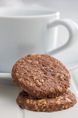 Sweet oatmeal cookies on white table.