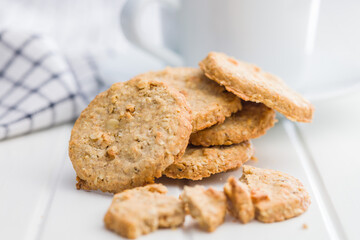 Sweet oatmeal cookies on white table.