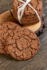 cookies with chocolate , chocolate biscuits with cocoa and sesame, close up, cookies are tied with rope
