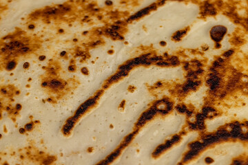 background of large pancakes made from milk and flour, hot pancakes made from milk with wheat flour of varying degrees of roasting